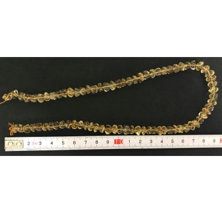 Citrino rondel facetado irregular 10*7 mm.